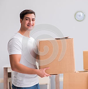 Man carrying boxes at home