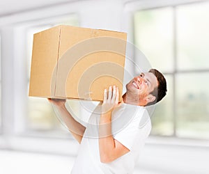 Man carrying carton heavy box