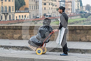 Man Carrying Garbage Bags