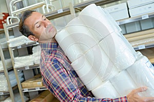 Man carrying goods at warehouse