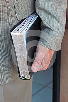 Man Carrying Holy Bible