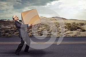 Man carrying large carton box