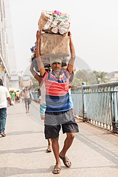 Man carrying load on the Howrah Bridge