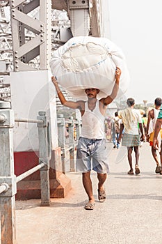 Man carrying load on the Howrah Bridge