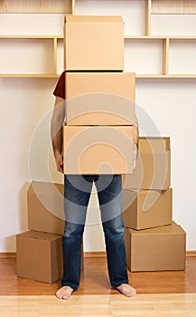 Man carrying lots of boxes - moving concept