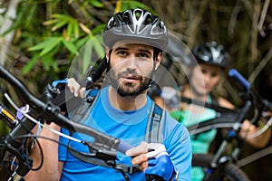 Man carrying mountain bike