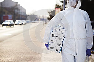 Man carrying reserves of toilet paper