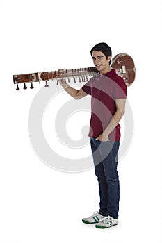 Man carrying sitar