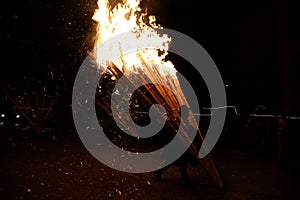 Man carrying a torch in the `Ndocciata`, evocative show of fire, heritage of Italy for tradition, Agnone, Molise, Italy