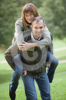 Man carrying woman
