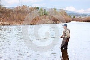 Man casting fly fishing rod