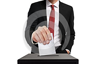 Man casting his vote into ballot box in close up