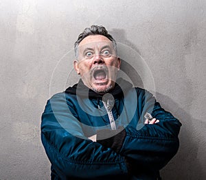 Man in casual clothing with a terrified look
