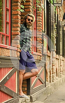 Man casual fashion. Hipster in sunglasses. Cool guy. Bearded man checkered shirt. Hipster dyed hair and beard