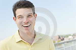 Man In Casual Laughing Against Clear Sky