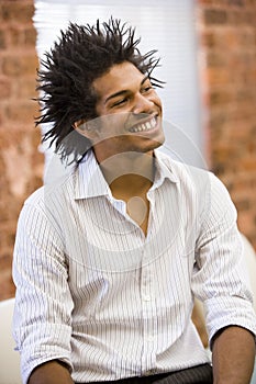 Man casually dressed in office