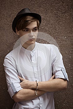 Man casually leaning against the wall