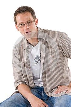 Man casually sitting on stool