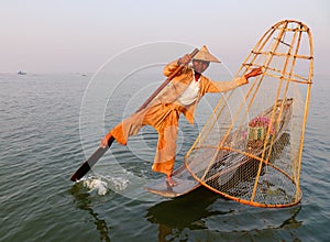 A man catching fish on the lake in Inle, Myanmar