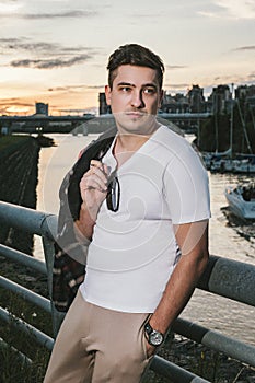 man caucasian model millionaire yachtsman in a white T-shirt