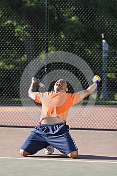 Man Celebrates on Tennis Court
