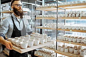 Man with ceramics at the pottery shop