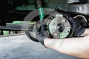 A man change Auto hub bearing wheel of car for maintenance concept