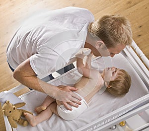 Man Changing Baby