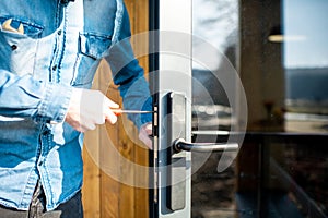 Man changing core of a door lock