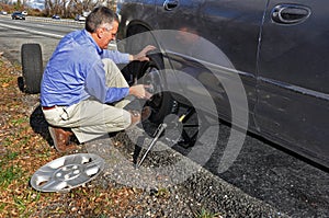 Man changing flat tire