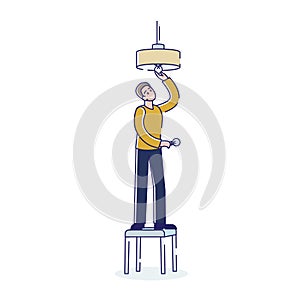 Man changing light bulb in ceiling lamp while standing on stool on white background