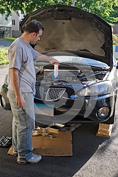 Man Changing the Oil