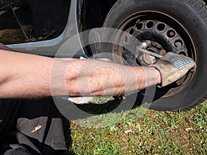 Man changing tires in spring