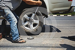 A man changing the wheel