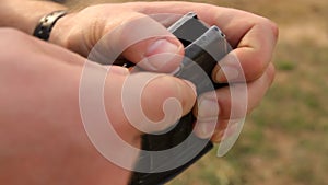 A man charges ammunition