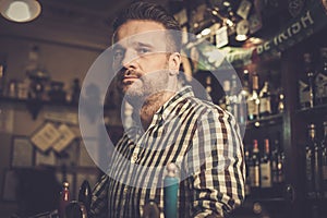 Man chatting with a bartender in a pub