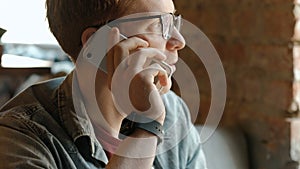 Man chatting on smart phone at cafe