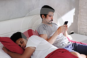Man Cheating His Partner Texting On Smartphone