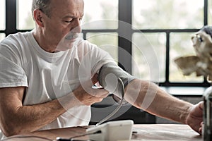 Man checking a blood pressure in the morning