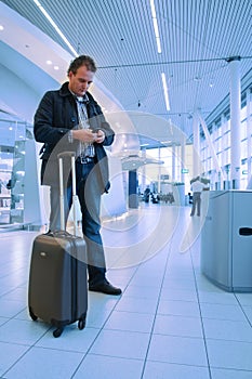 Man checking email on airport