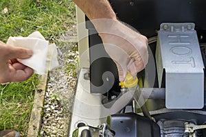 Man checking engine oil in generator. Maintenance, Mechanic Inspecting the generator.