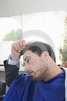 Man Checking Freshly Cut Hair