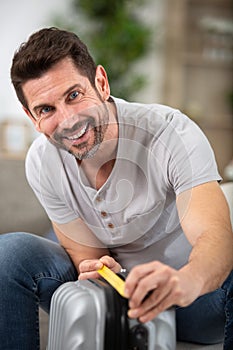 Man checking hand luggage length