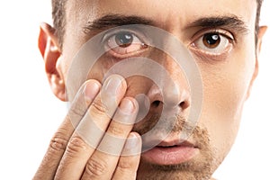 Man checking health condition of his eye