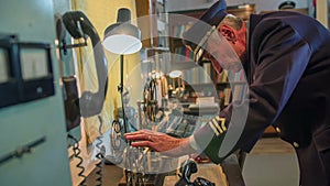 Man checking the previous received telegraphs