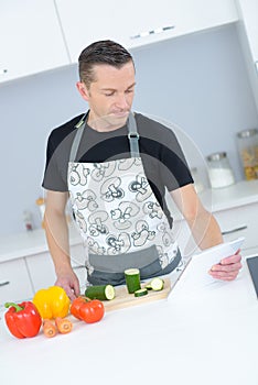 Man checking recipe online