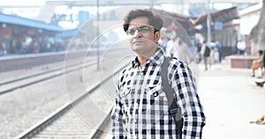 Man checking time while waiting at railway station