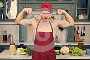 Man chef in apron on torso show biceps, triceps