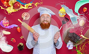 Man chef is happy to cook a new creative recipe. burgundy color background