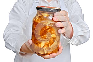 Man chef with jar of fruit jam in hands on isolated on a white backgrou